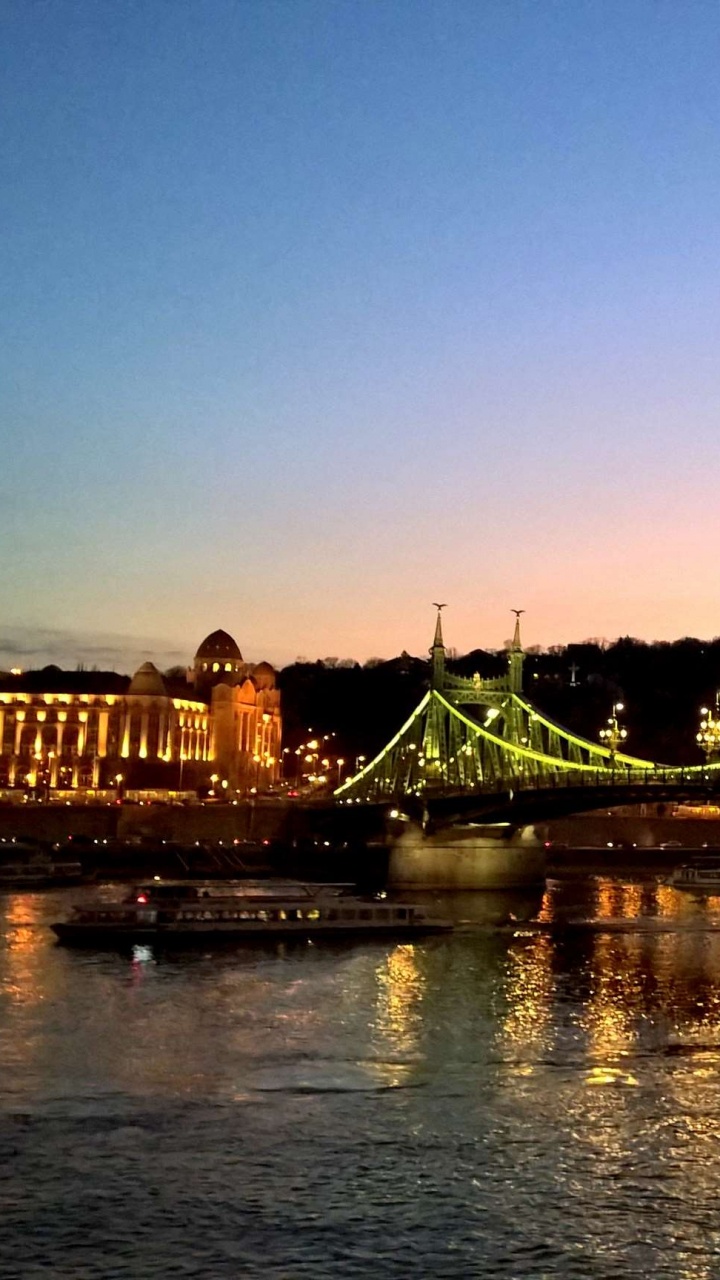 Bridge Over Water During Night Time. Wallpaper in 720x1280 Resolution