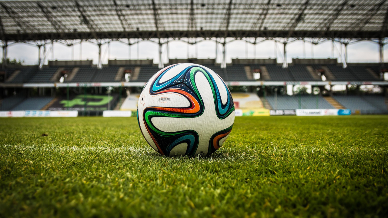 White Blue and Black Soccer Ball on Green Grass Field During Daytime. Wallpaper in 1280x720 Resolution