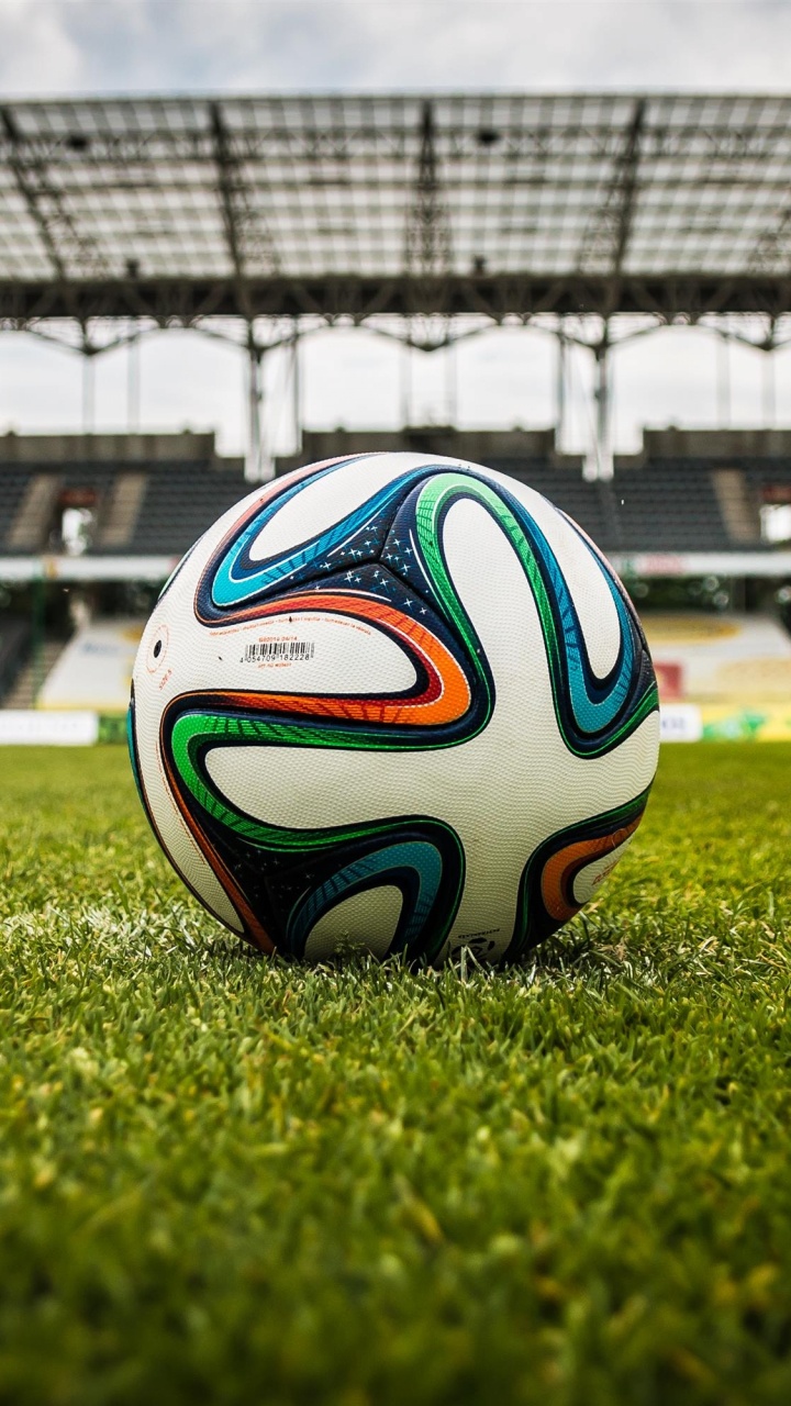 White Blue and Black Soccer Ball on Green Grass Field During Daytime. Wallpaper in 720x1280 Resolution