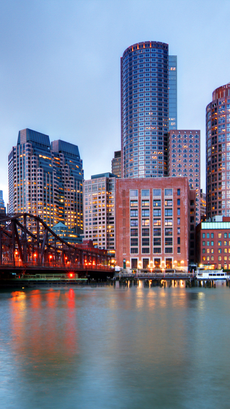City Skyline Across Body of Water During Night Time. Wallpaper in 750x1334 Resolution