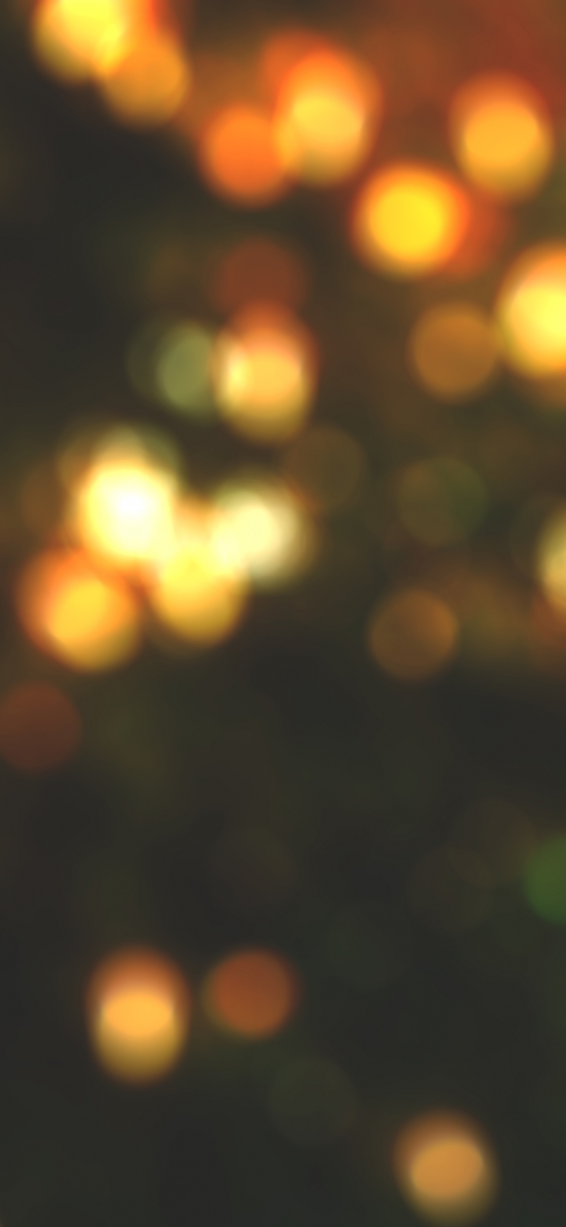 Gelbe Und Grüne Bokeh-Lichter. Wallpaper in 1125x2436 Resolution