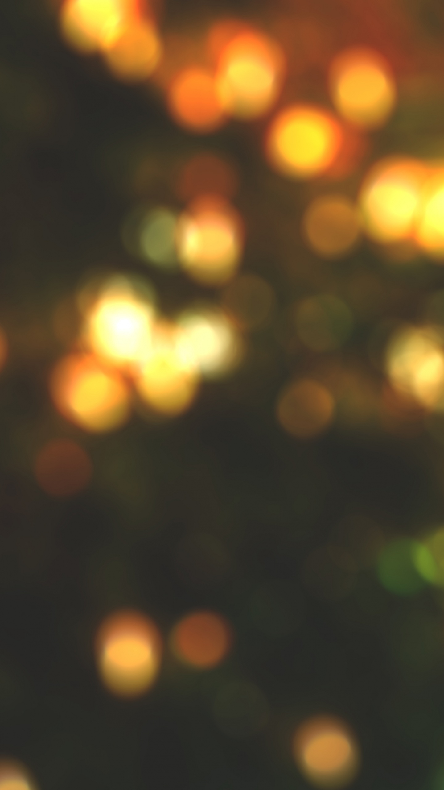 Gelbe Und Grüne Bokeh-Lichter. Wallpaper in 1440x2560 Resolution