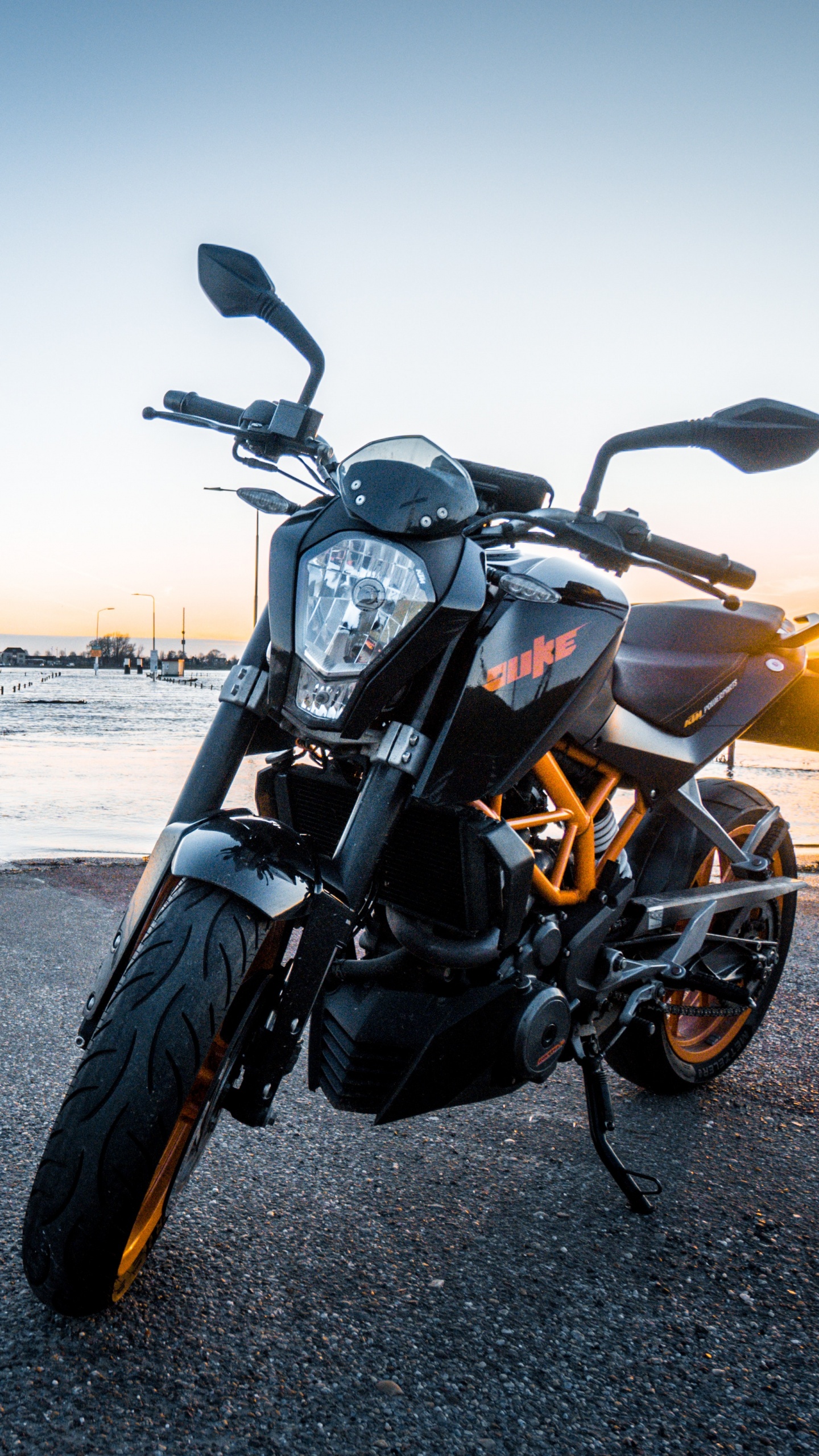 Black Motorcycle on Gray Asphalt Road During Daytime. Wallpaper in 1440x2560 Resolution
