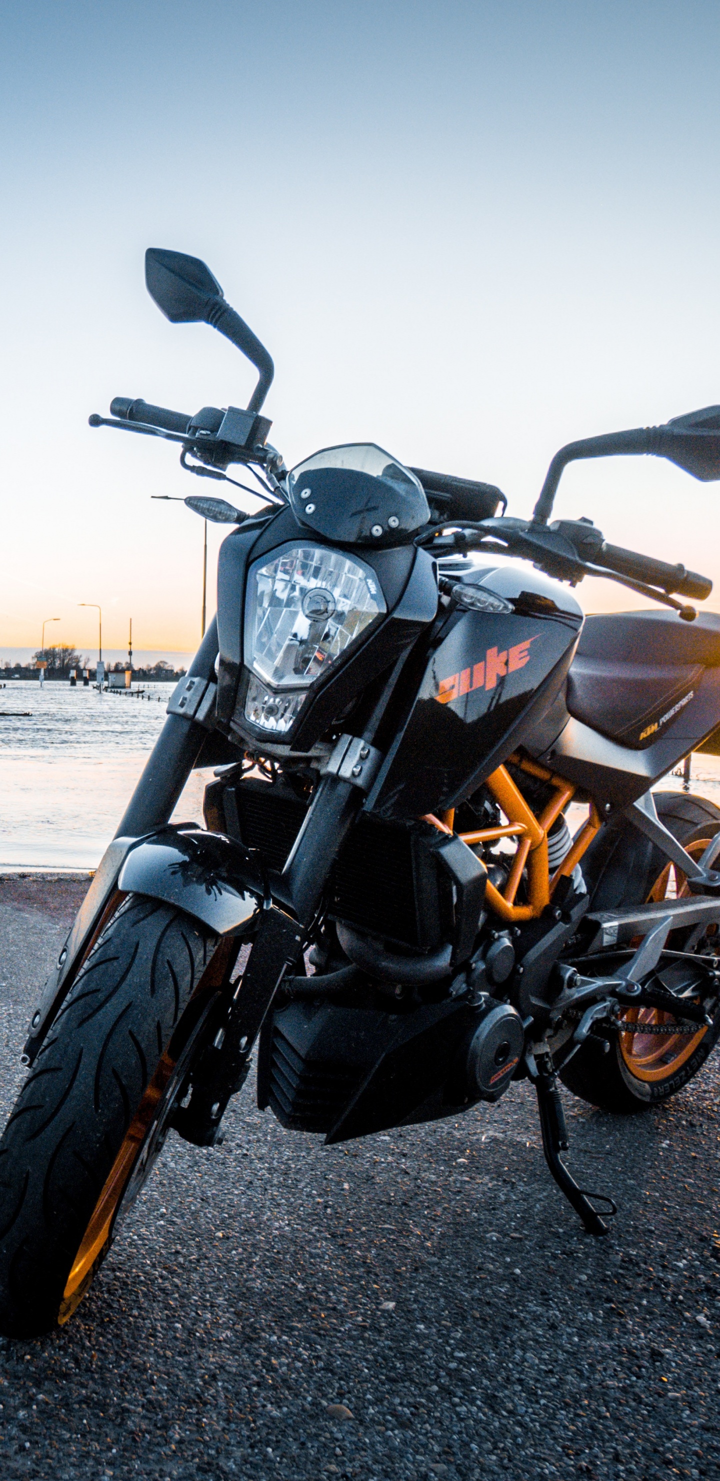 Black Motorcycle on Gray Asphalt Road During Daytime. Wallpaper in 1440x2960 Resolution