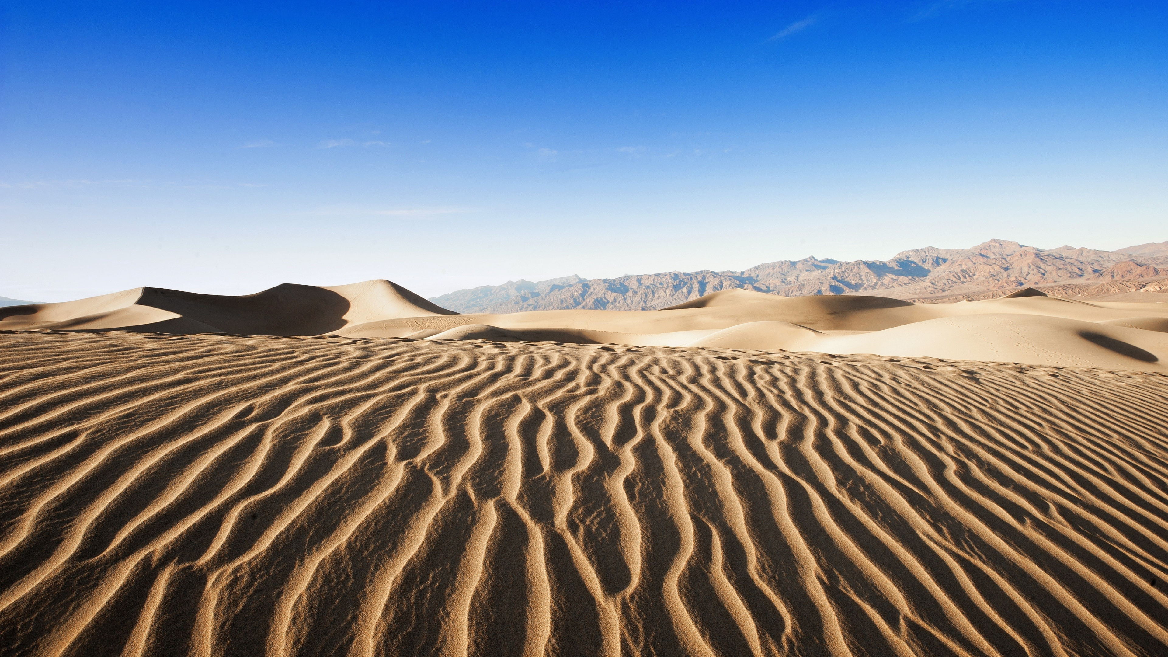 Brown Sand Under Blue Sky During Daytime. Wallpaper in 3840x2160 Resolution