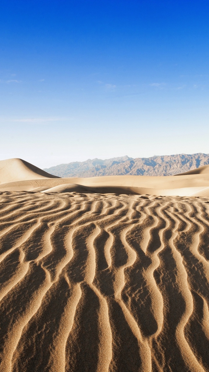 Brown Sand Under Blue Sky During Daytime. Wallpaper in 720x1280 Resolution