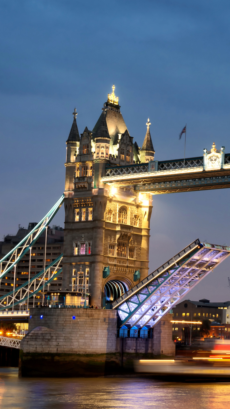 Brown Bridge Under Blue Sky During Night Time. Wallpaper in 750x1334 Resolution