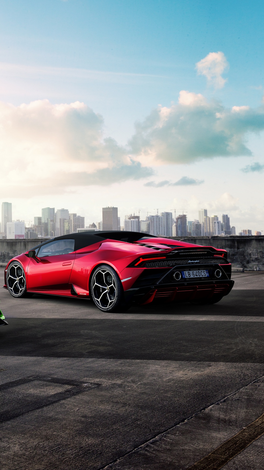 Green Ferrari Sports Car on Road During Daytime. Wallpaper in 1080x1920 Resolution