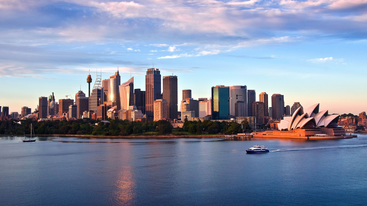 City Skyline Across Body of Water Under Cloudy Sky During Daytime. Wallpaper in 1280x720 Resolution