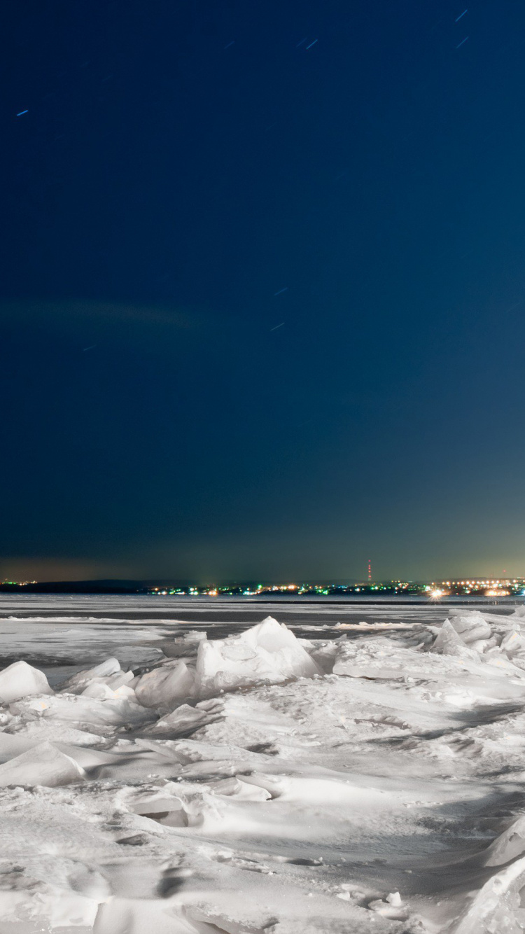 Snow Covered Field Under Blue Sky During Daytime. Wallpaper in 750x1334 Resolution