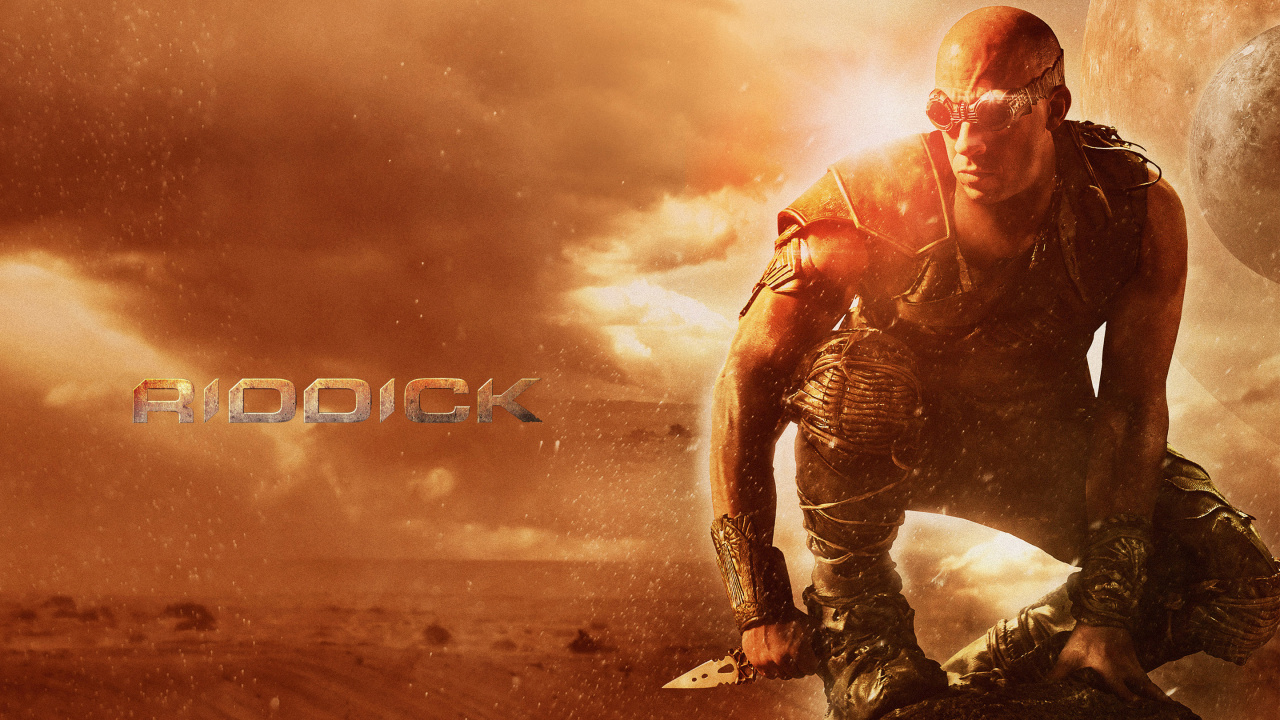 Hombre Con Chaqueta de Cuero Negro y Jeans de Mezclilla Azul de Pie Sobre Arena Marrón. Wallpaper in 1280x720 Resolution