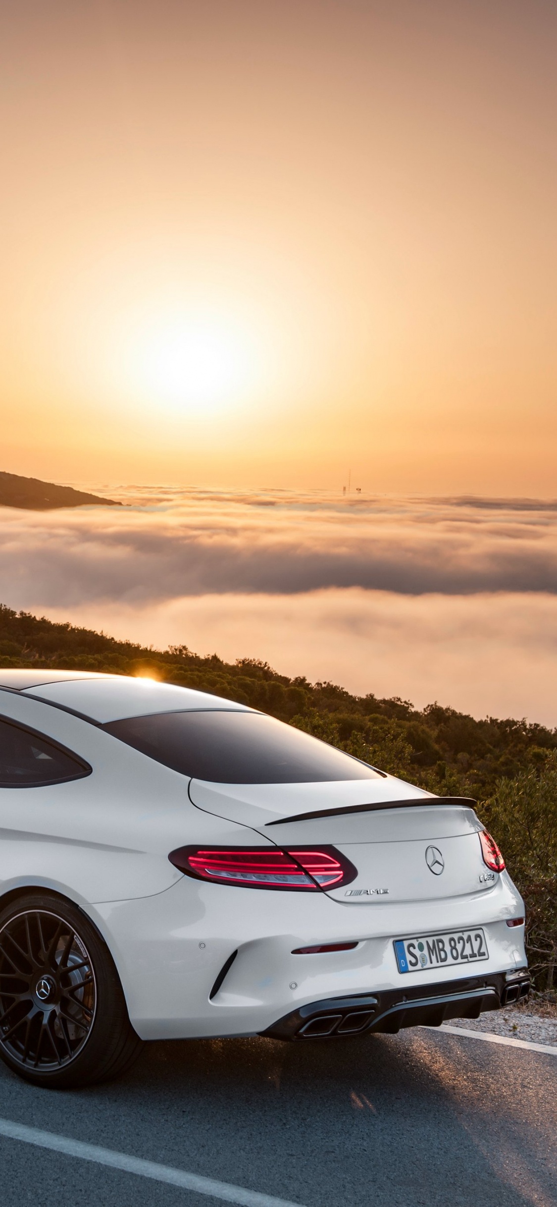 White Porsche 911 on Road During Daytime. Wallpaper in 1125x2436 Resolution