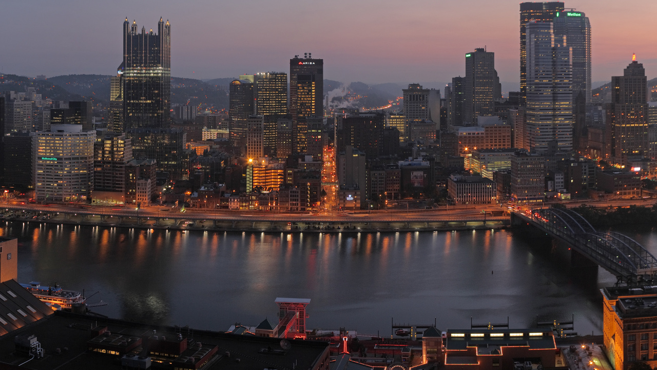 City Skyline Near Body of Water During Night Time. Wallpaper in 1280x720 Resolution