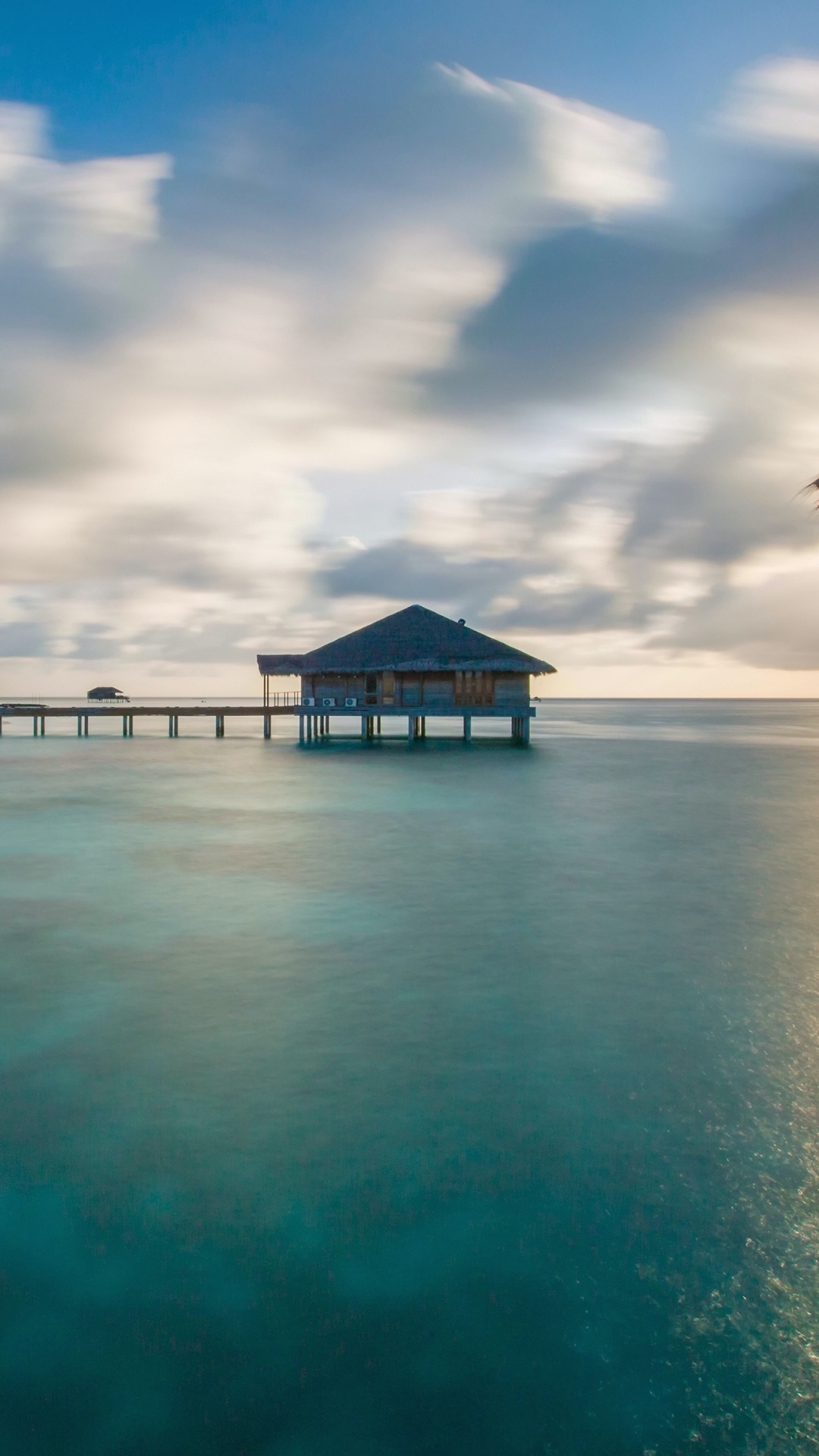 Brown Wooden House on Beach Under Blue Sky During Daytime. Wallpaper in 1080x1920 Resolution