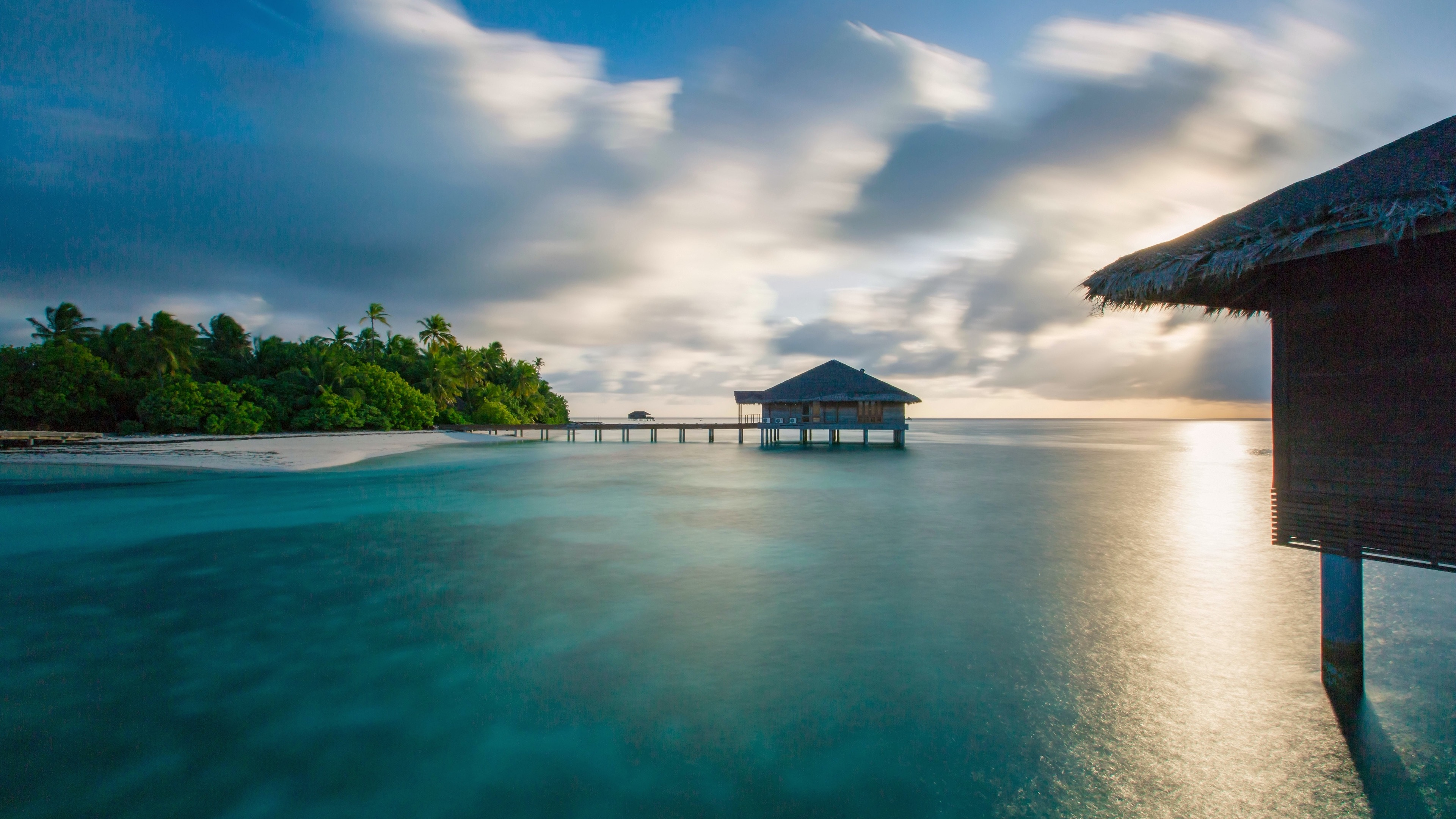 Brown Wooden House on Beach Under Blue Sky During Daytime. Wallpaper in 3840x2160 Resolution