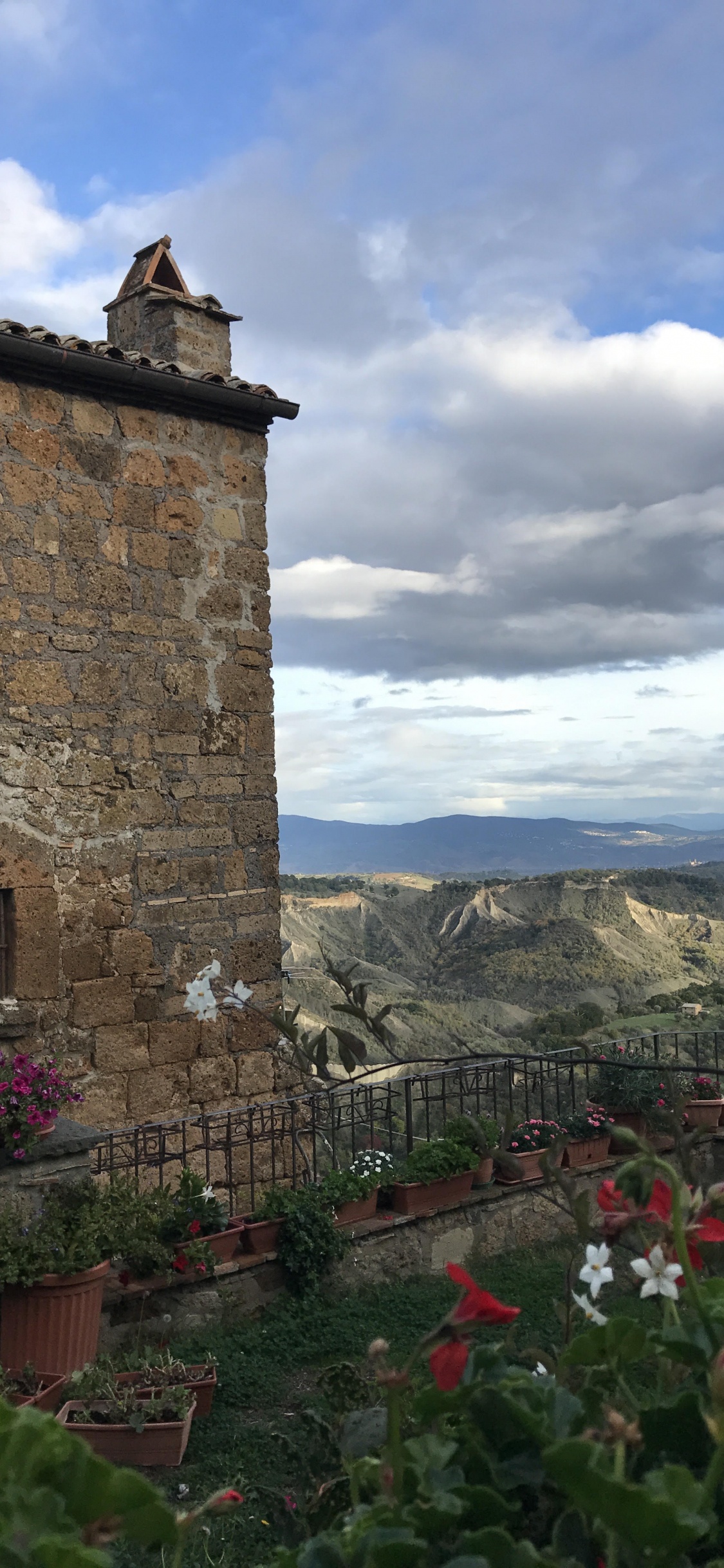 Wall, Building, Cloud, Village, Mountain. Wallpaper in 1125x2436 Resolution