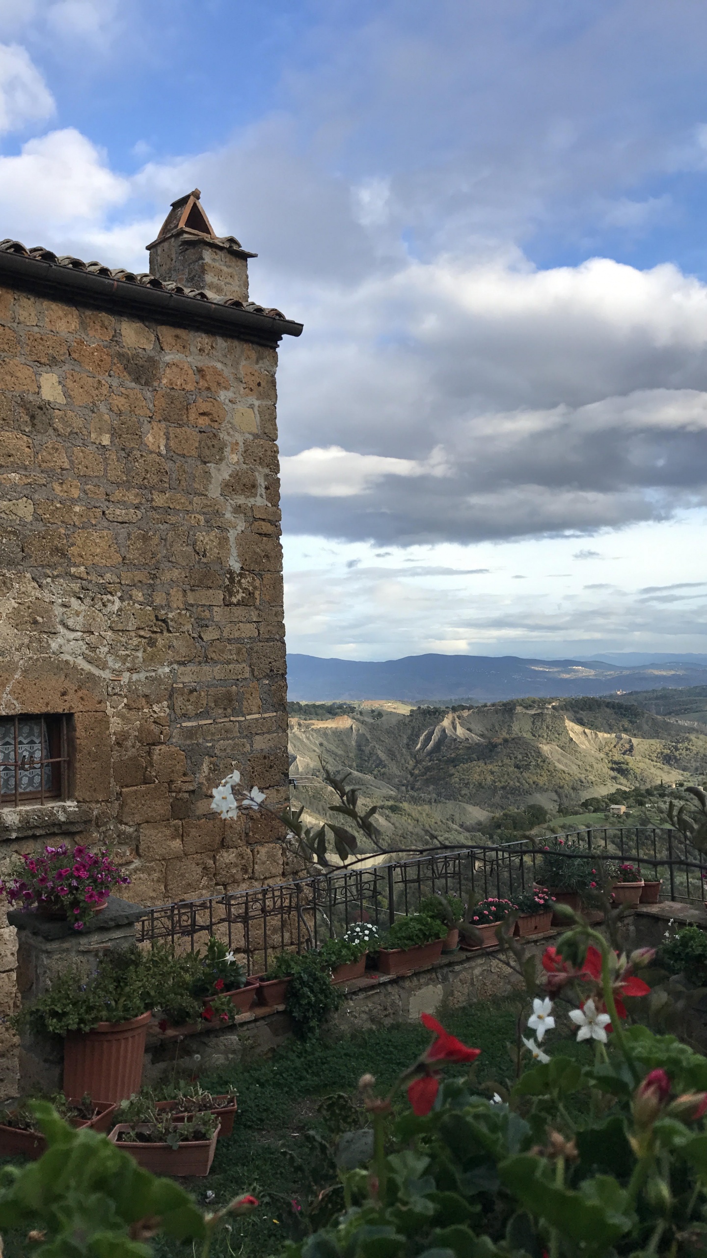 Wall, Building, Cloud, Village, Mountain. Wallpaper in 1440x2560 Resolution
