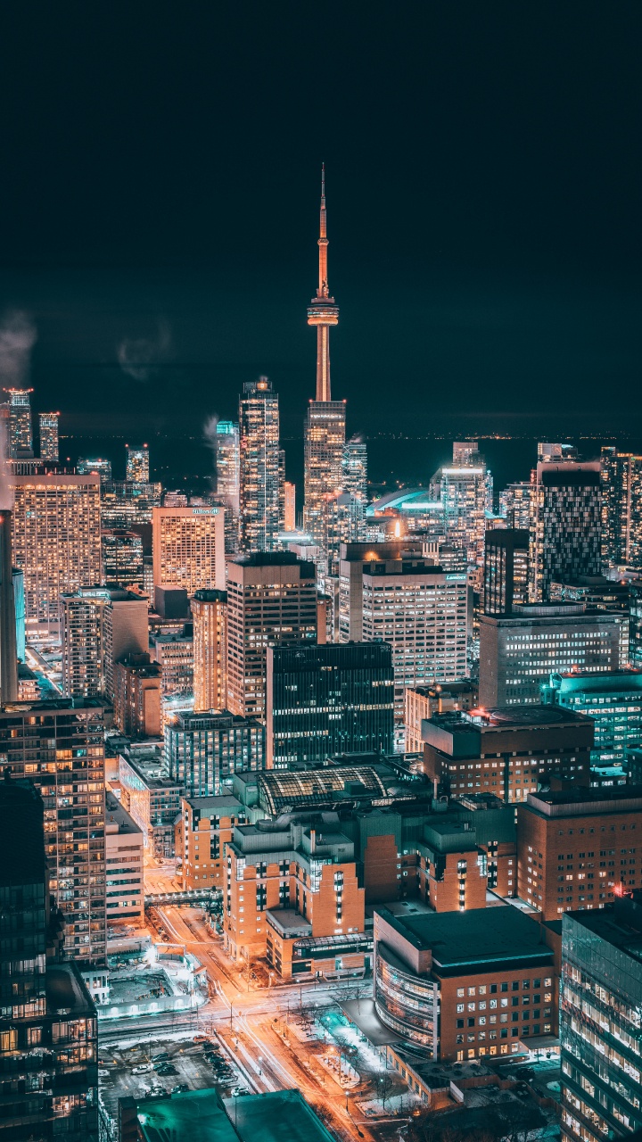 City With High Rise Buildings During Night Time. Wallpaper in 720x1280 Resolution