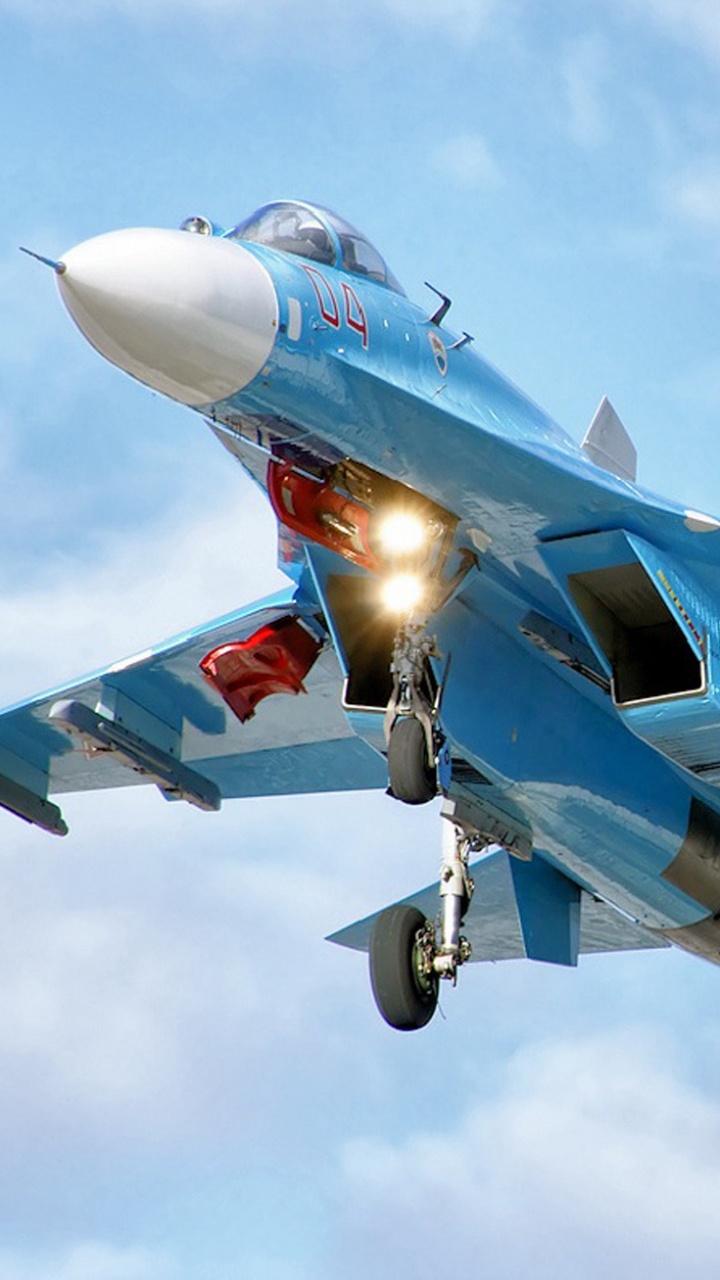 Avion à Réaction Bleu et Blanc Dans Les Airs Pendant la Journée. Wallpaper in 720x1280 Resolution