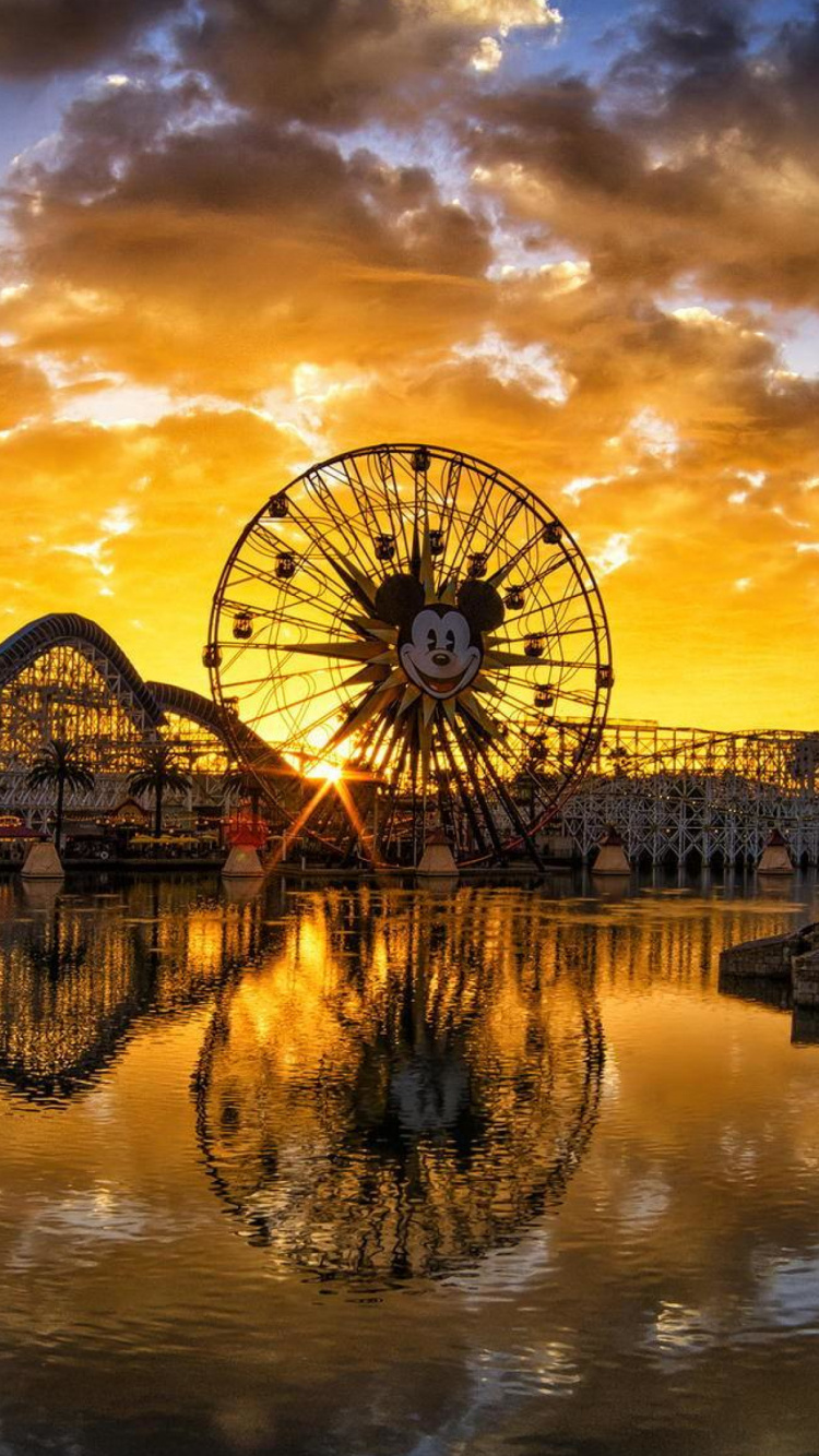 Red Ferris Wheel Beside River Under Cloudy Sky During Daytime. Wallpaper in 750x1334 Resolution