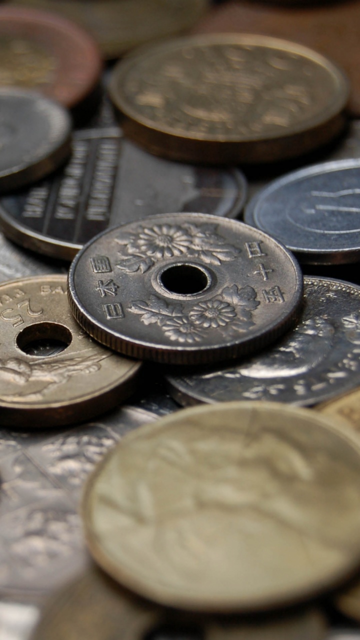 Silver Round Coins on Black Surface. Wallpaper in 720x1280 Resolution