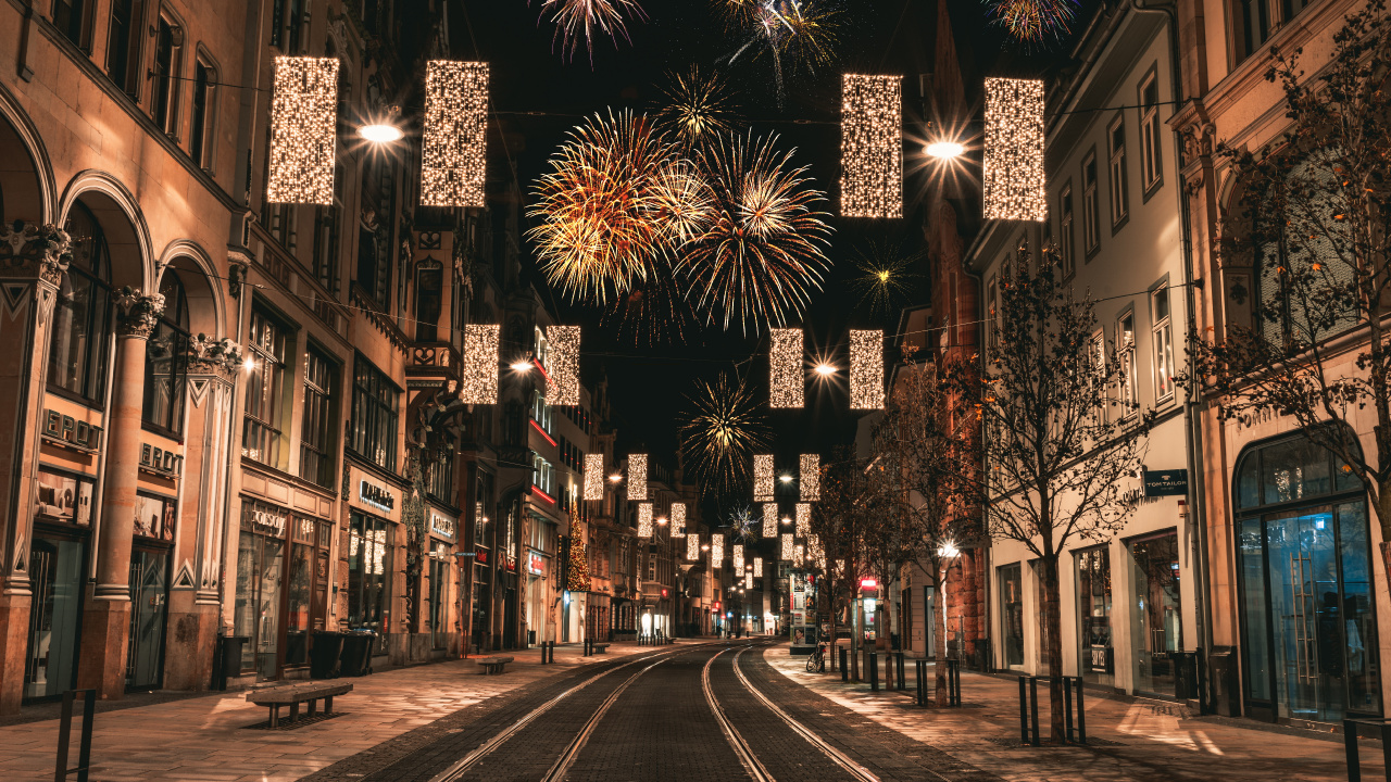 People Walking on Street With Fireworks Display During Night Time. Wallpaper in 1280x720 Resolution