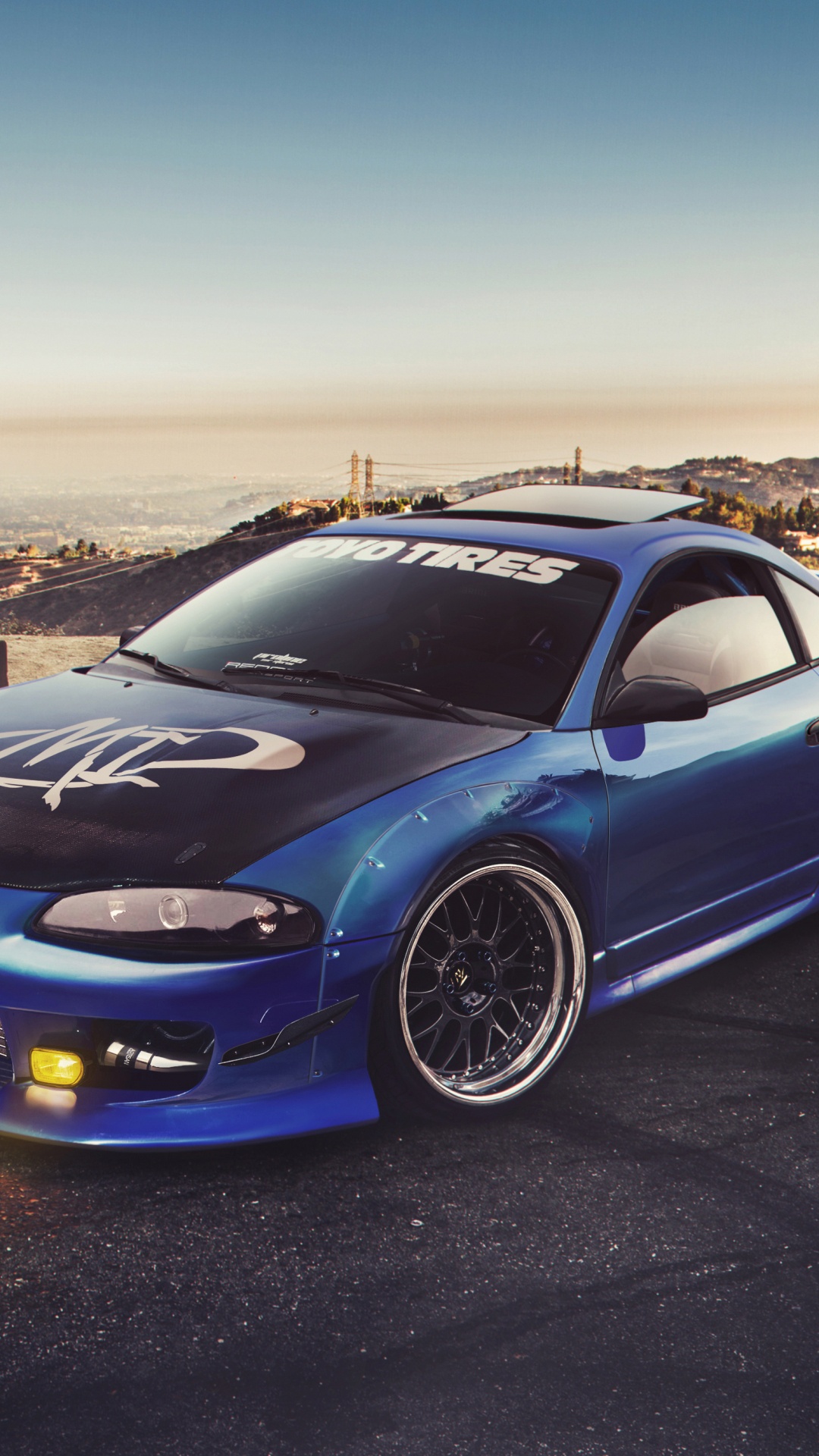 Blaues Bmw m 3 Coupe Geparkt Auf Braunem Feldweg Tagsüber. Wallpaper in 1080x1920 Resolution