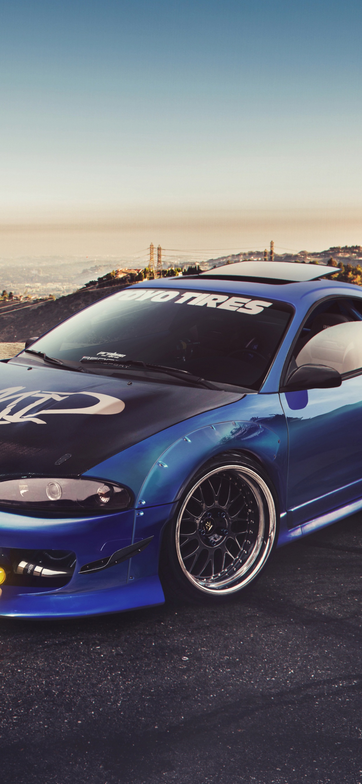 Blaues Bmw m 3 Coupe Geparkt Auf Braunem Feldweg Tagsüber. Wallpaper in 1242x2688 Resolution