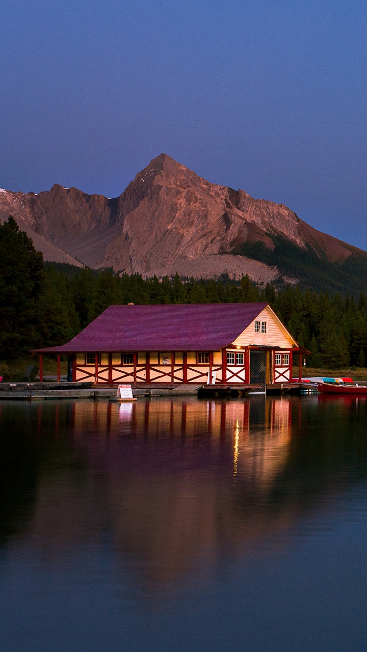 Red and Brown House Near Lake and Green Mountains During Daytime. Wallpaper in 720x1280 Resolution