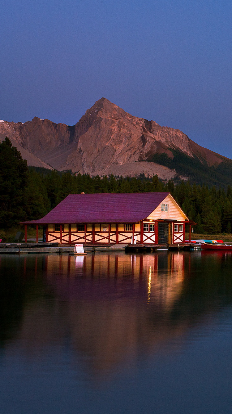 Red and Brown House Near Lake and Green Mountains During Daytime. Wallpaper in 750x1334 Resolution