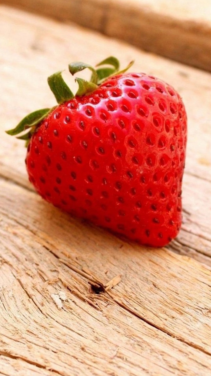 Red Strawberry on Brown Wooden Table. Wallpaper in 720x1280 Resolution
