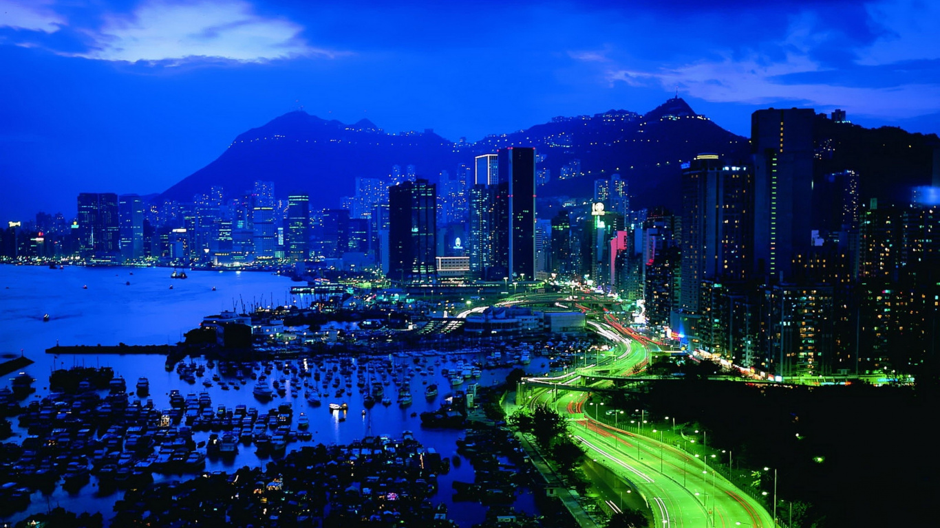 City Skyline Near Body of Water During Night Time. Wallpaper in 1366x768 Resolution