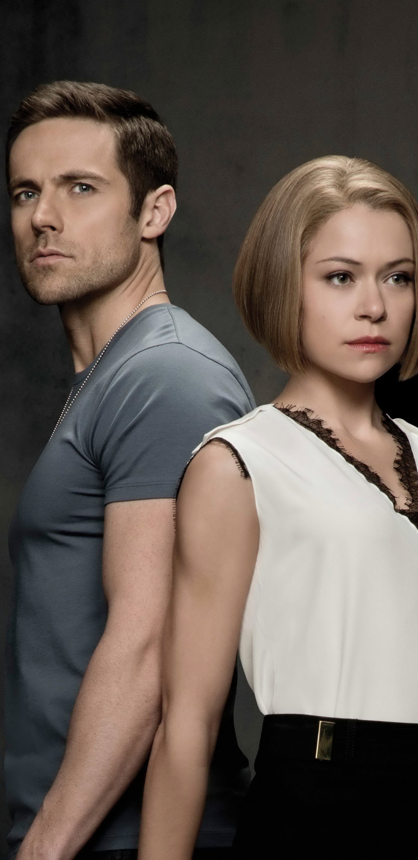 Man in Black Vest Standing Beside Woman in White Sleeveless Shirt. Wallpaper in 1440x2960 Resolution