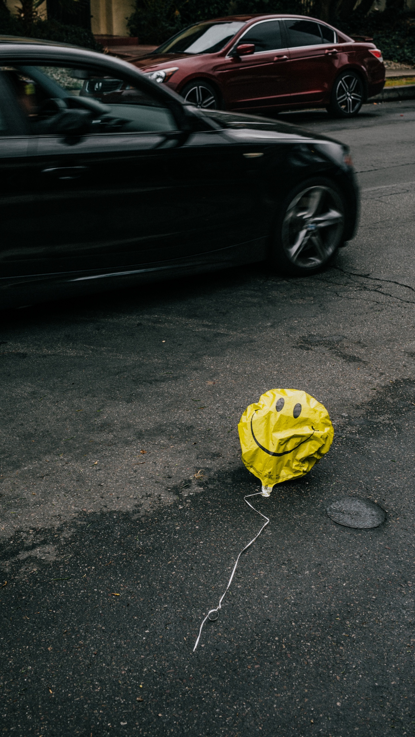 Yellow Balloon on Gray Asphalt Road. Wallpaper in 1440x2560 Resolution