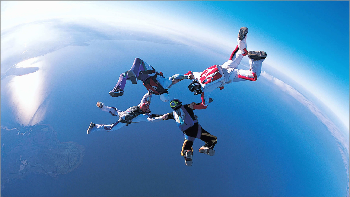 People in Blue and White Shirt and Pants Doing Sky Diving During Daytime. Wallpaper in 1366x768 Resolution