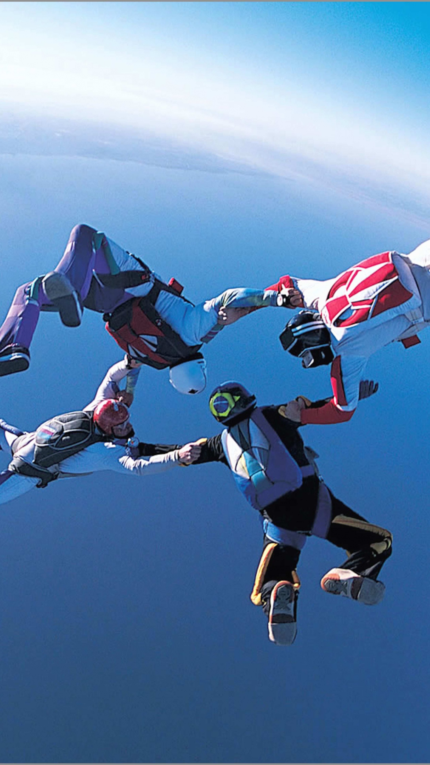 People in Blue and White Shirt and Pants Doing Sky Diving During Daytime. Wallpaper in 1440x2560 Resolution