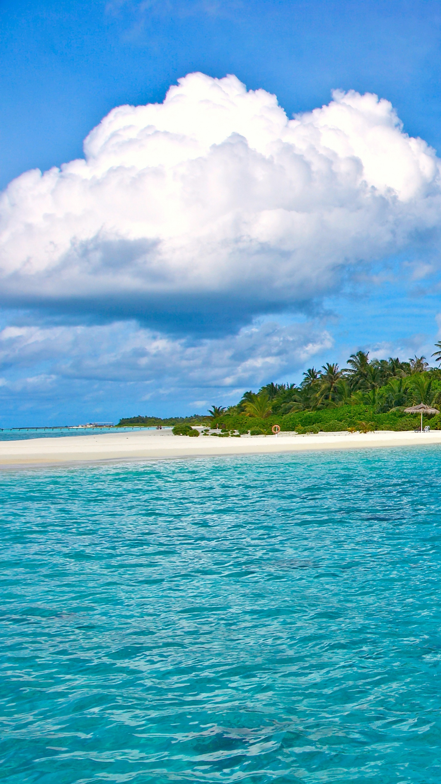 People in White and Green Boat on Blue Sea Under Blue and White Cloudy Sky During. Wallpaper in 1440x2560 Resolution