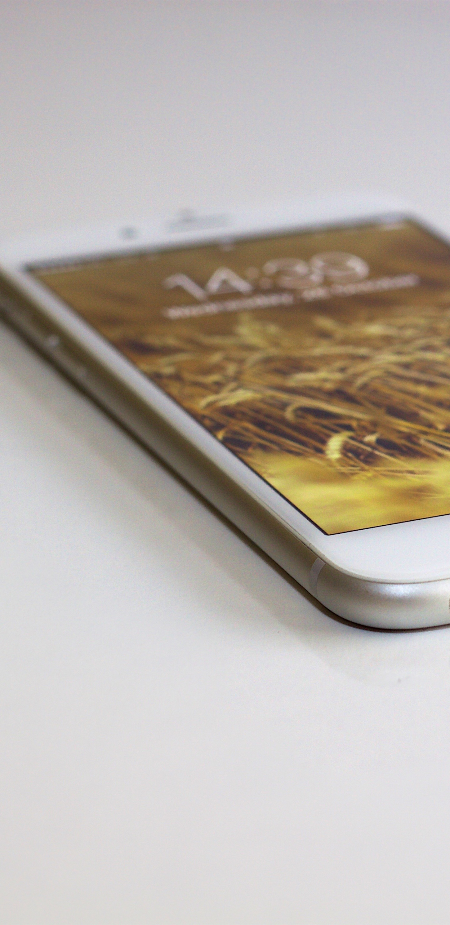 Gold Iphone 6 on White Table. Wallpaper in 1440x2960 Resolution