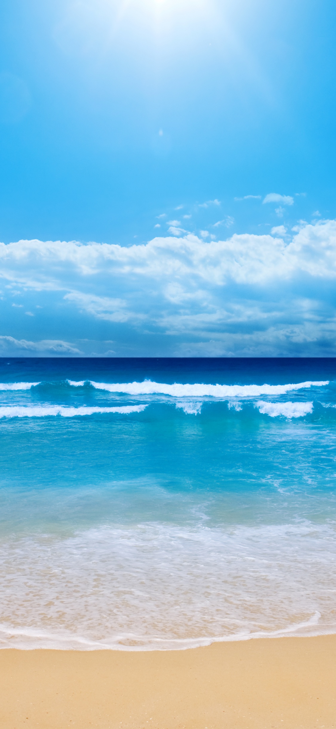 Blue Sea Under Blue Sky During Daytime. Wallpaper in 1125x2436 Resolution