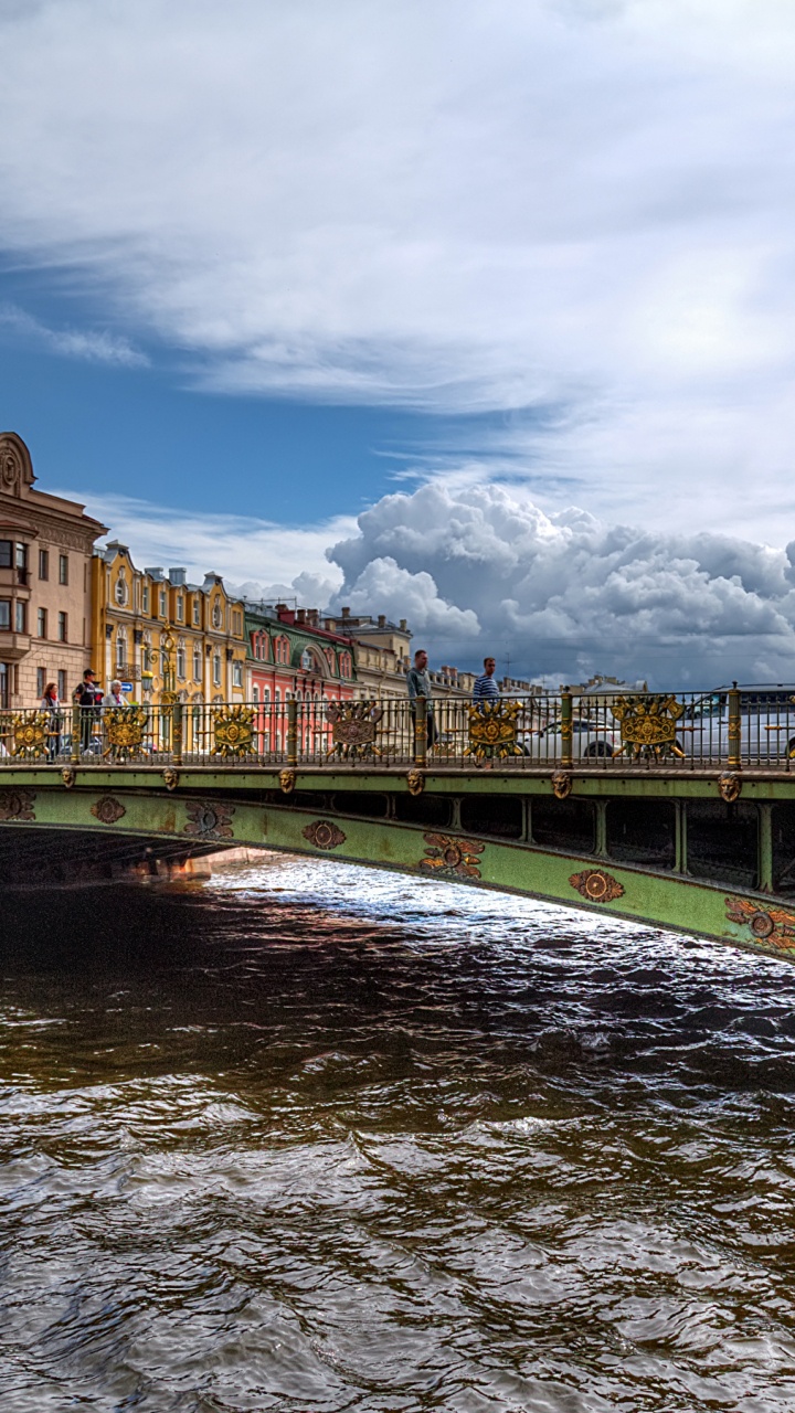 Brown Concrete Building Near Bridge Under Cloudy Sky During Daytime. Wallpaper in 720x1280 Resolution