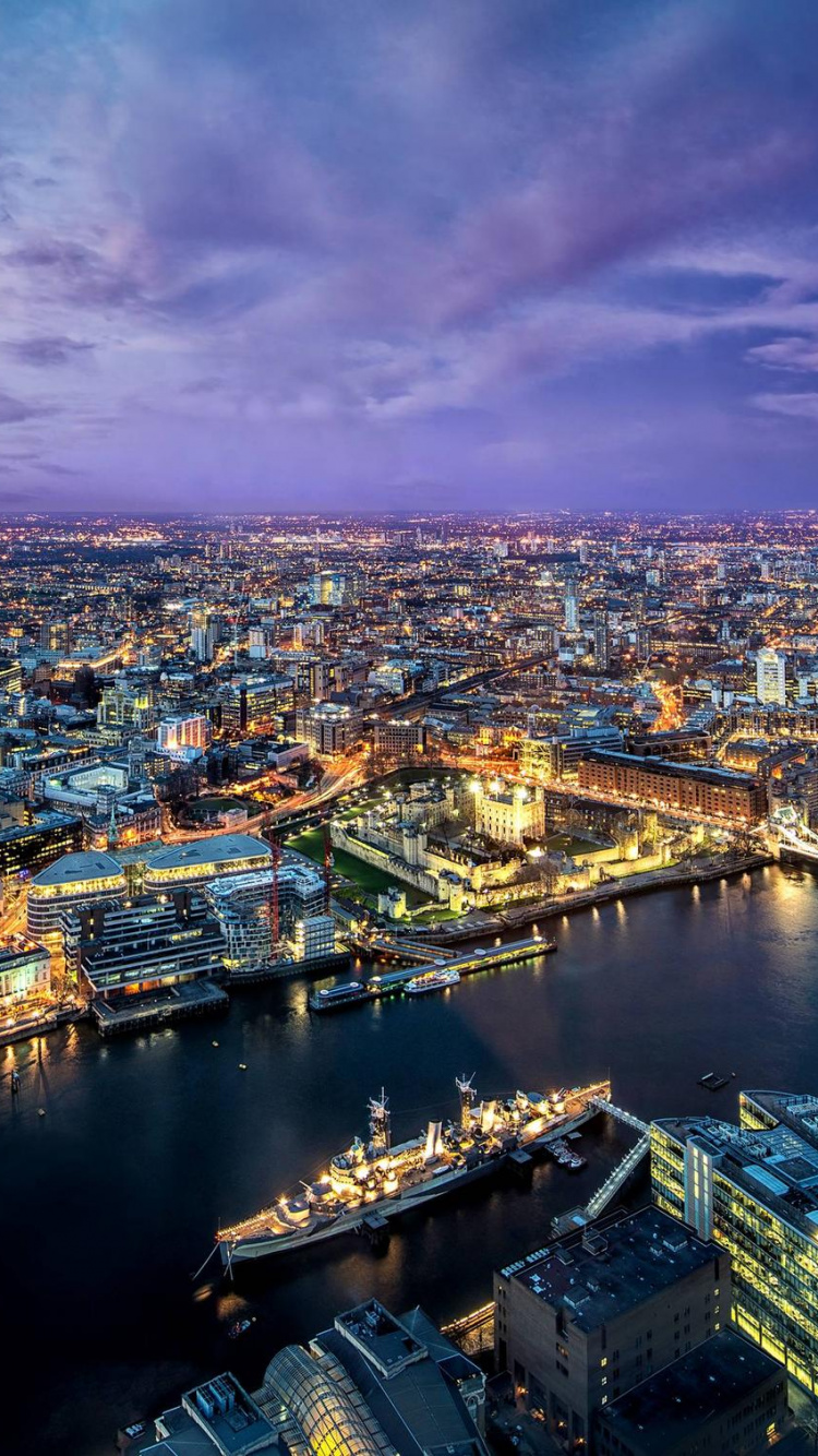 Aerial View of City Buildings During Night Time. Wallpaper in 750x1334 Resolution