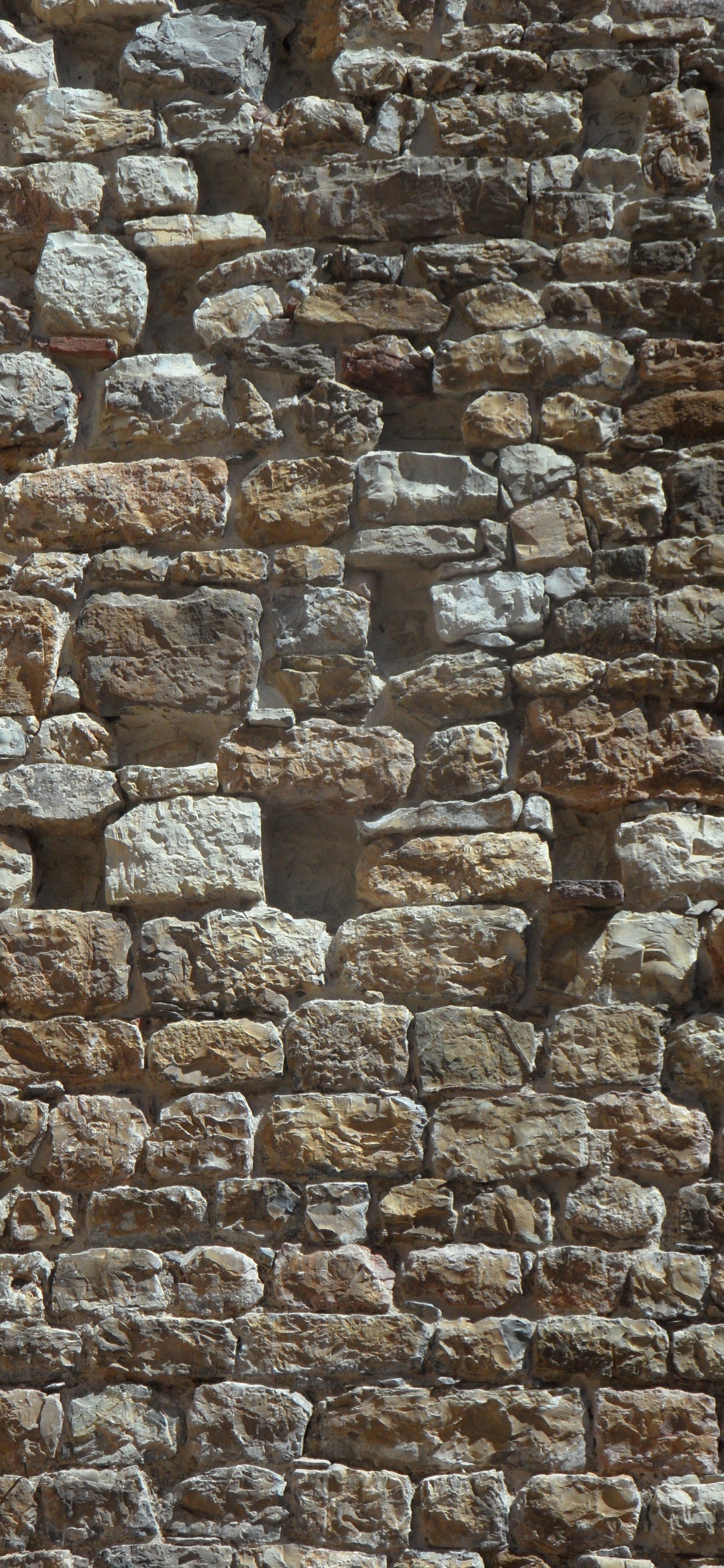 Braune Und Graue Mauer. Wallpaper in 1125x2436 Resolution