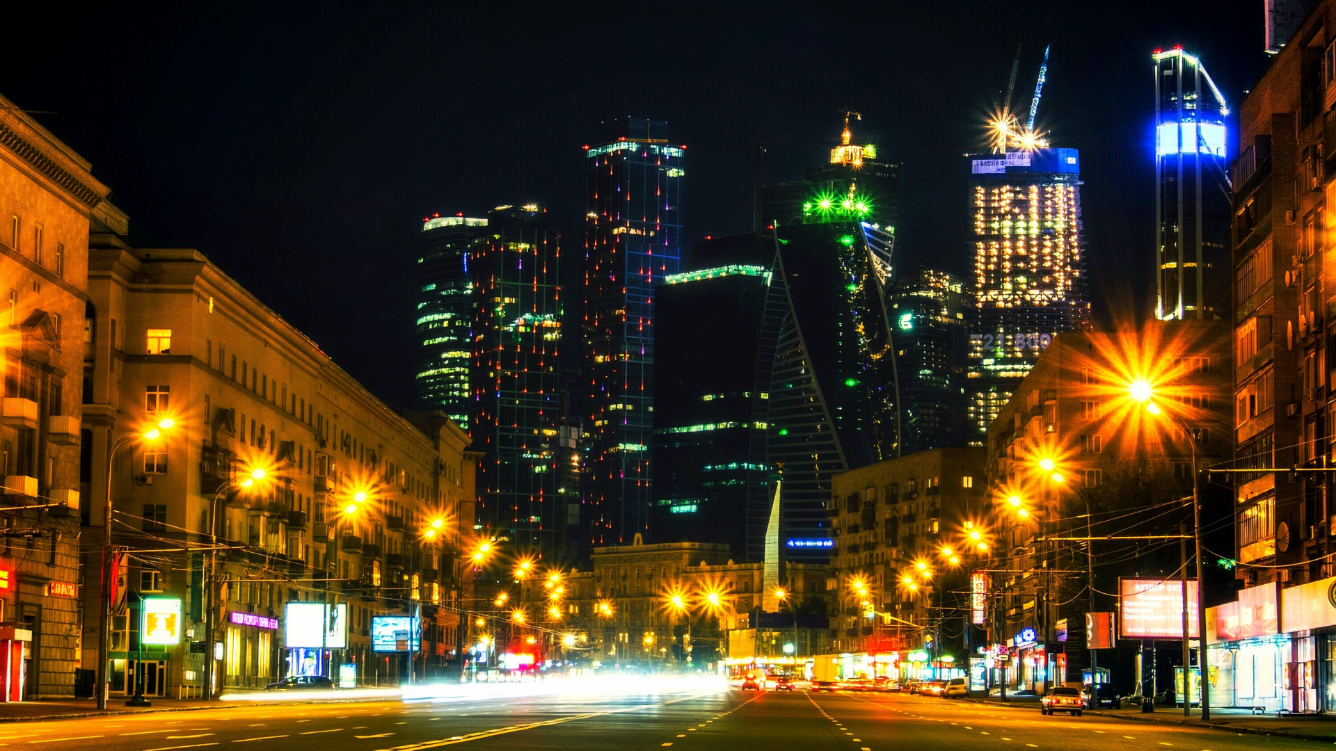 Cars on Road Near High Rise Buildings During Night Time. Wallpaper in 1920x1080 Resolution