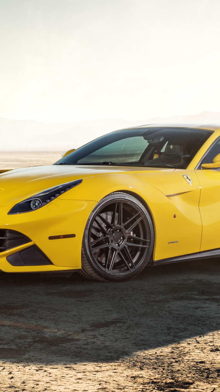 Gelber Porsche 911 Auf Braunem Sand Tagsüber. Wallpaper in 750x1334 Resolution