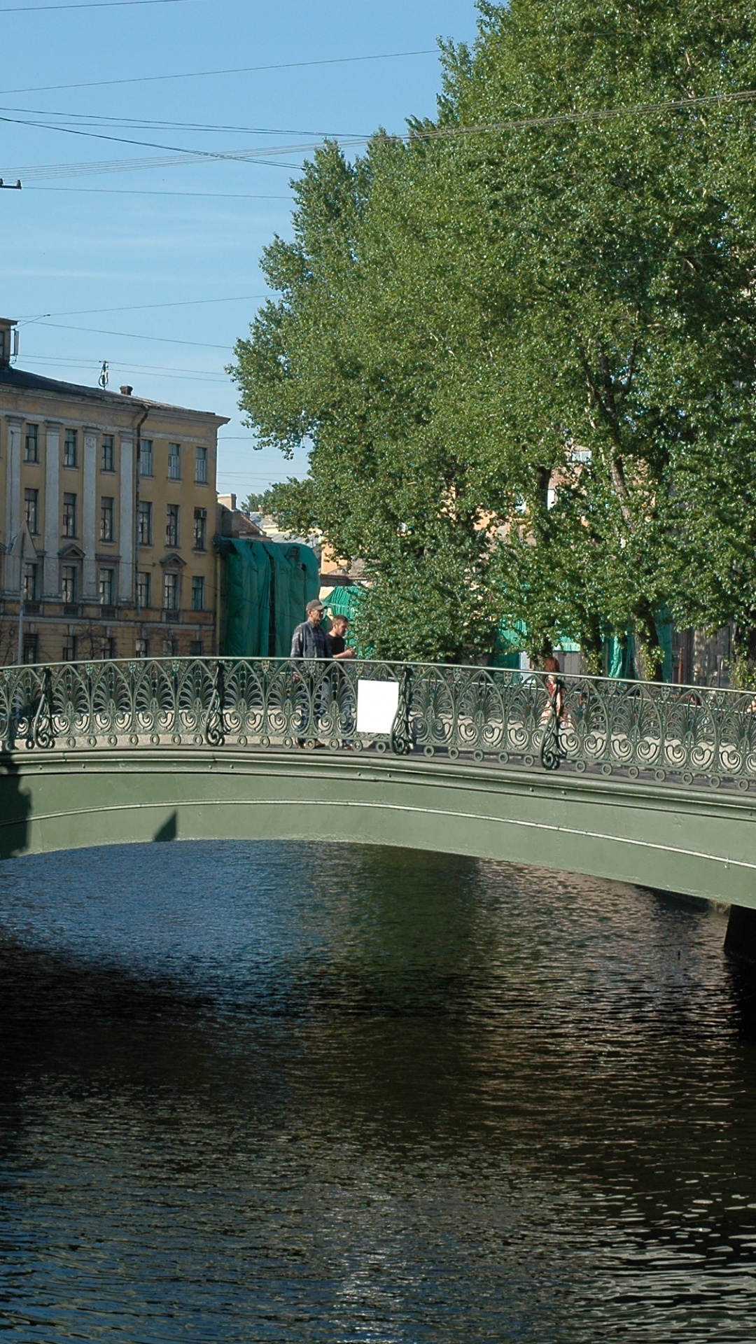 People Walking on Bridge Over River During Daytime. Wallpaper in 1080x1920 Resolution