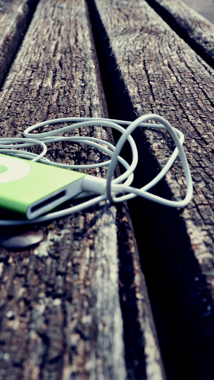 White and Green Iphone 5 c on Brown Wooden Table. Wallpaper in 720x1280 Resolution