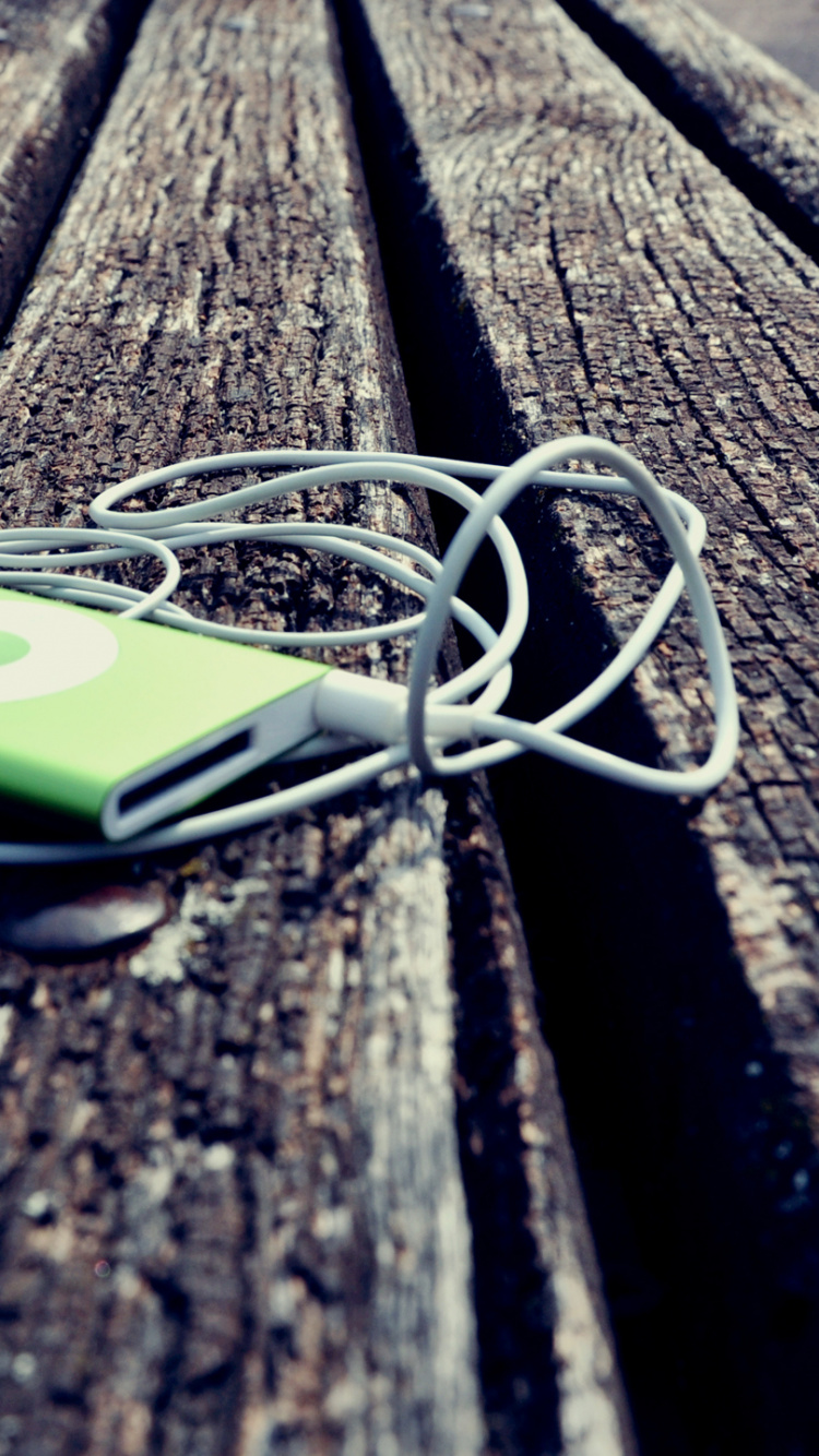 White and Green Iphone 5 c on Brown Wooden Table. Wallpaper in 750x1334 Resolution