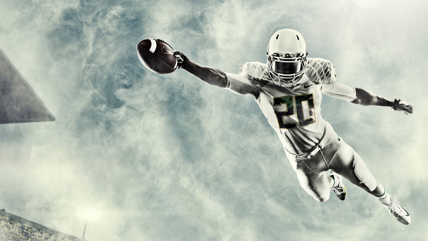 Football Player in Green and White Jersey Holding Red Football. Wallpaper in 1366x768 Resolution