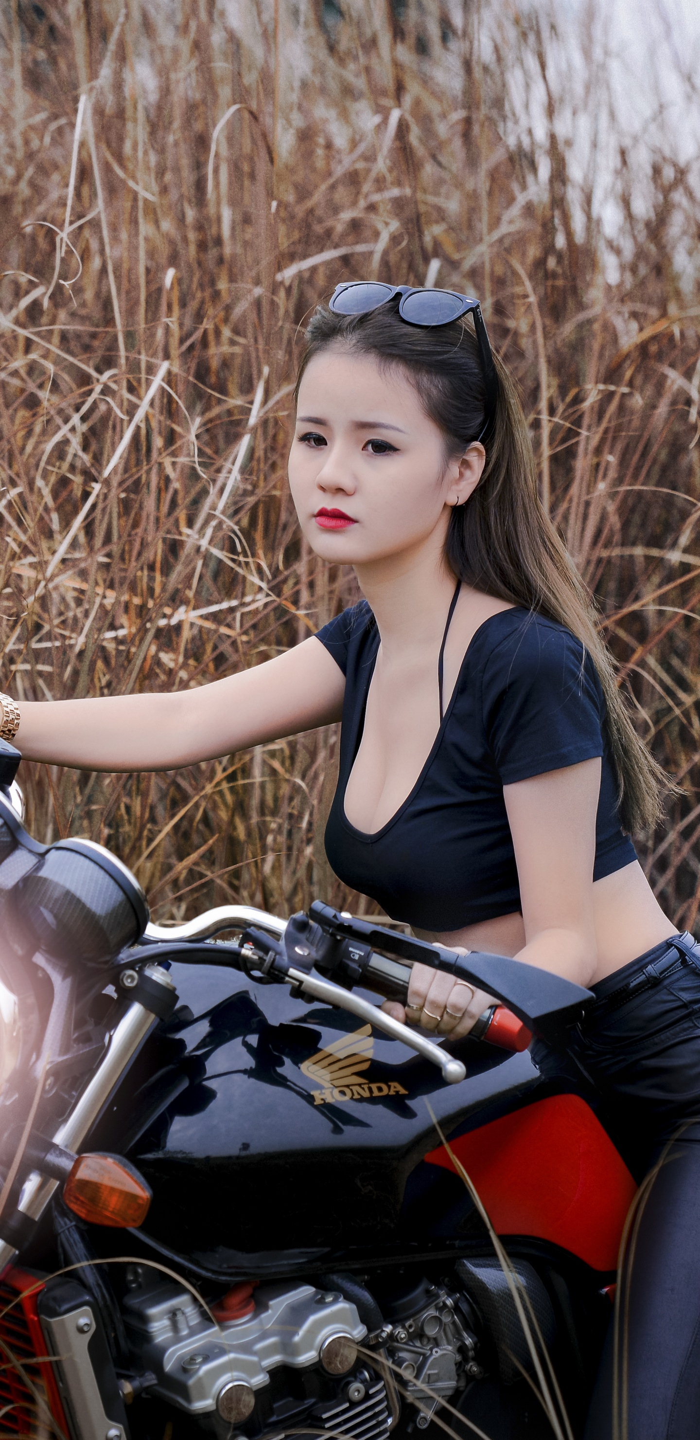 Woman in Black Tank Top and Black Leggings Sitting on Red and Black Motorcycle. Wallpaper in 1440x2960 Resolution