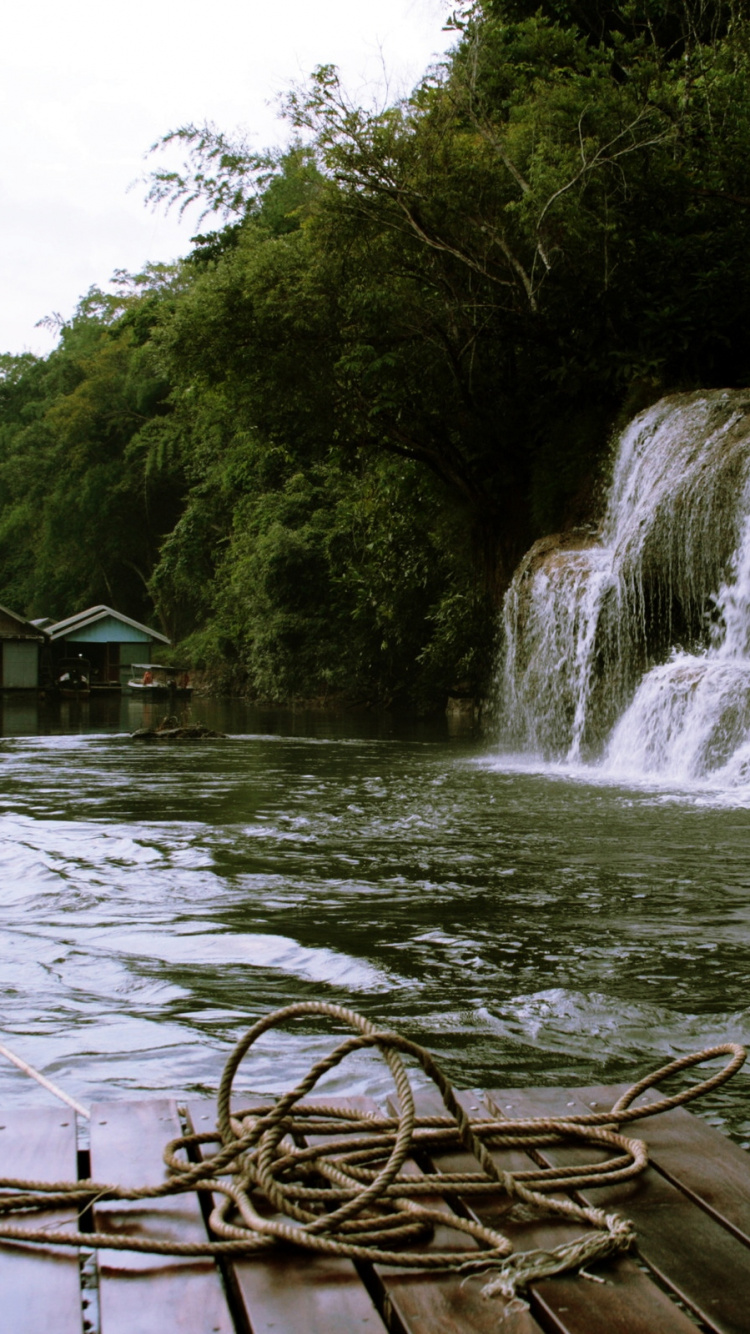 Brown Wooden Boat on Water Near Green Trees During Daytime. Wallpaper in 750x1334 Resolution